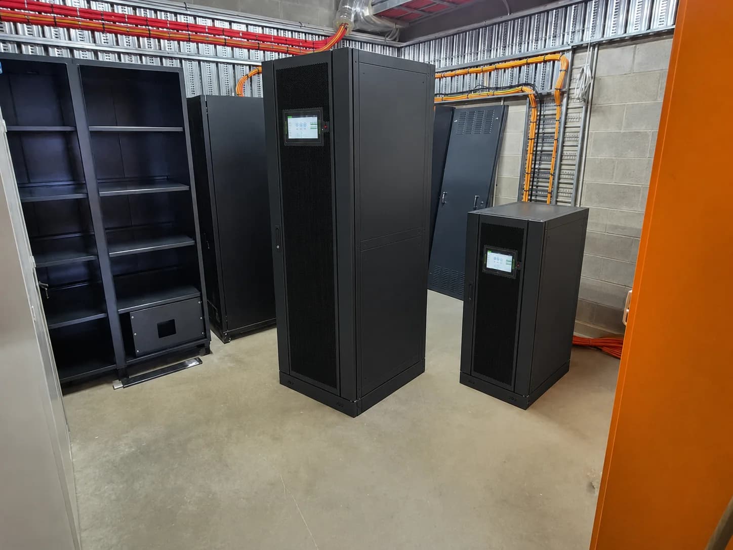 M Series modular UPS cabinets shown in an installation room reference image