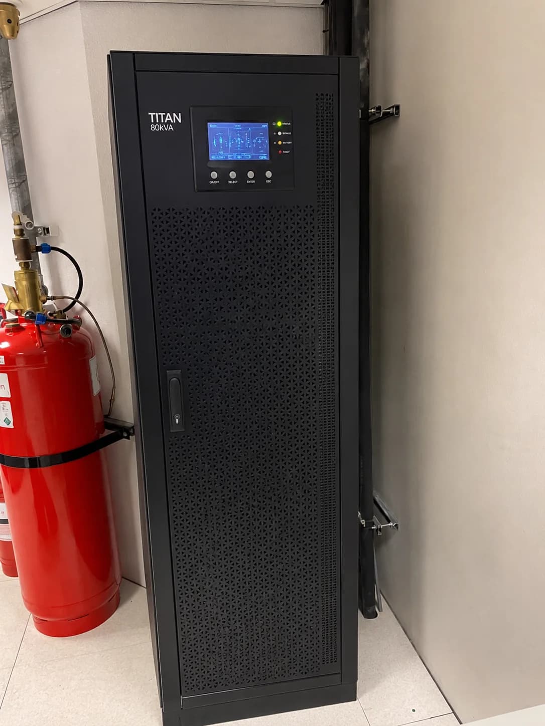 TITAN 80kVA UPS cabinet shown beside site equipment in a reference image